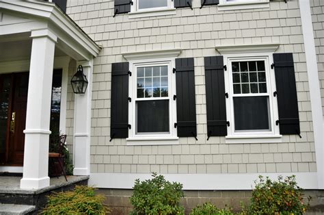 beige house black shutters